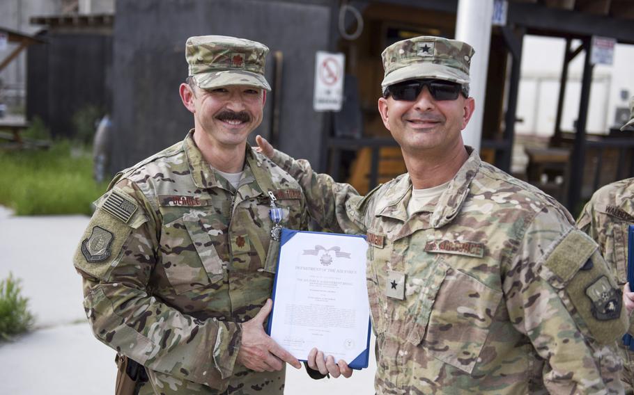 Kenneth Beadle, an Air Force major at the time and a physicians assistant from the 455th Expeditionary Medical Group, stands with Brig. Gen. David Julazadeh, the 455th Air Expeditionary Wing commander, after being awarded the Air Force Achievement Medal in April 2016. Beadle, now a lieutenant colonel, was fired Monday, July 11, 2022, from command of the 27th Special Operations Medical Readiness Squadron at Cannon Air Force Base, N.M.