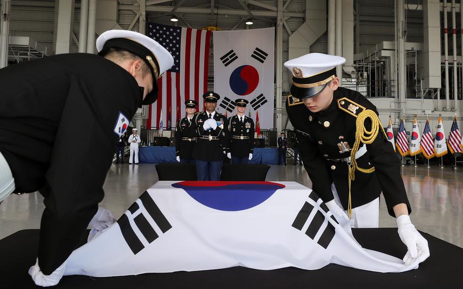 South Korean soldiers prepare to carry the remains of Korean War dead during a ceremony at Joint Base Pearl Harbor-Hickam, Hawaii, July 25, 2023. 