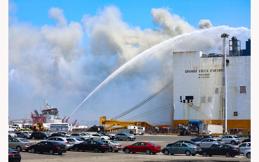 A New York City fireboat continues to pour water on the blaze on Thursday July 6, 2023, in Newark, N.J.