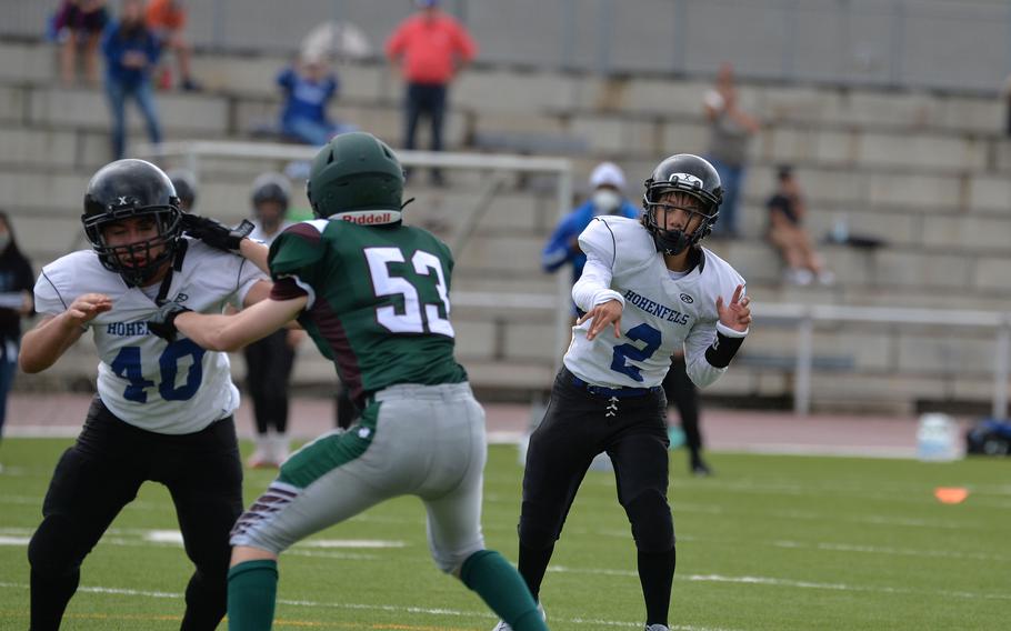 Hohenfels quarterback John Bamba connects for a 2-point conversion in the Tigers’ 76-28 loss to the Lions in a Division 3 game played at Kaiserslautern High School, Sept. 11, 2021. At left are Oscar Martinez and Caden Snider.