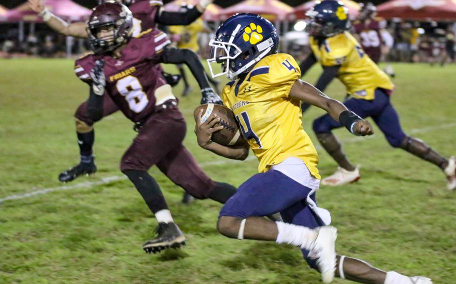 Guam High sophomore quarterback Aaron Johnson, the other Guam league co-MVP, was pressured all night by Father Duenas defenders such as Christian Manglona.