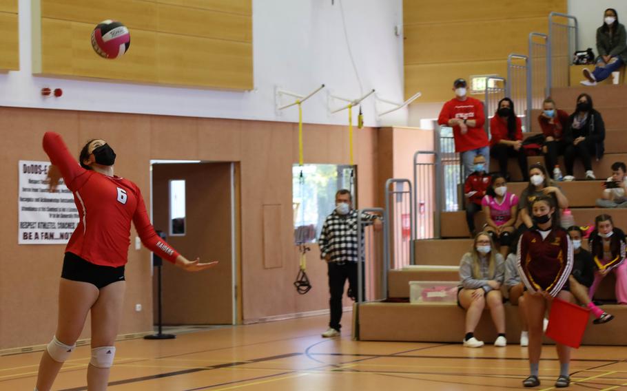 Kaiserslautern’s Rebecca Lagares, left, serves a ball during a volleyball match against Hohenfels at Vilseck, Germany, Saturday, Oct. 9, 2021.