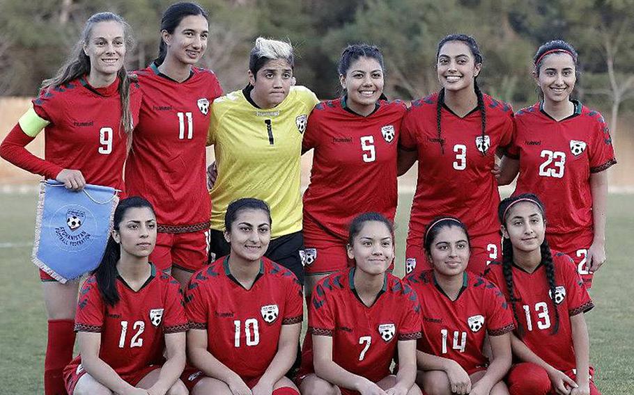 Members of the Afghan women's national soccer team pose in a February 2018 photo. Eighty-six players, officials and family members were evacuated from Afghanistan to Australia.