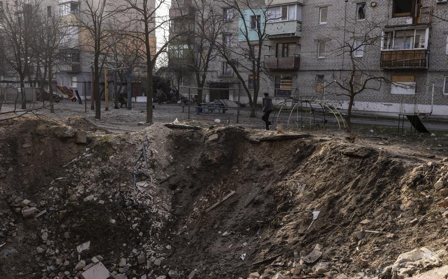 A Russian attack that hit the Triangle apartment complex, in Lyman, Ukraine, in April left a massive crater.