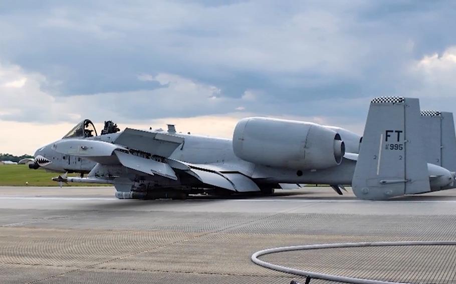 A screenshot from a U.S. Air Force video shows the A-10C that Capt. Taylor Bye belly-landed in April 2020, after a malfunction stopped the landing gear from deploying and ripped the canopy off. For her skill in landing the crippled jet, Bye was awarded the Koren Kolligian Jr. Trophy at the Pentagon, May 11, 2022. The plane has since been restored and is being flown again.