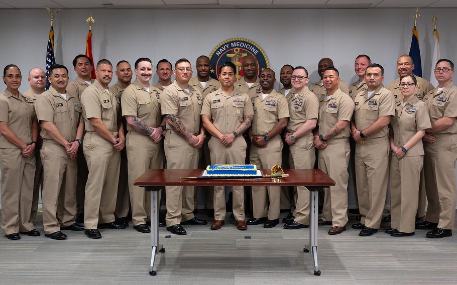 A group of Navy chief pose for a photo