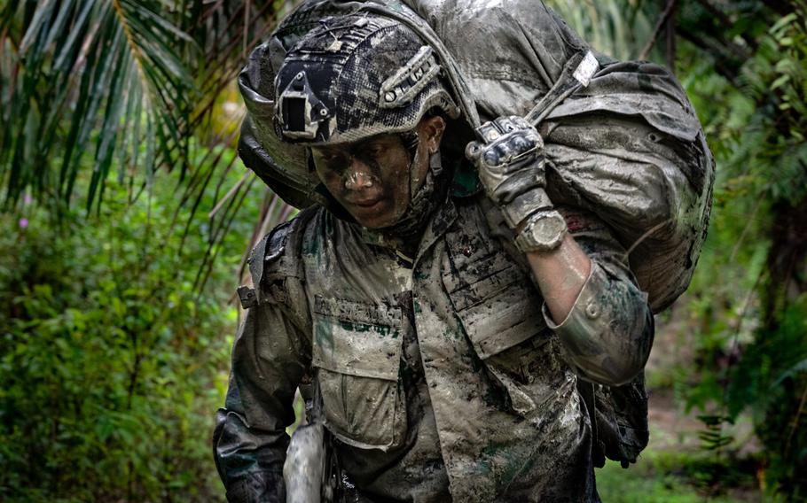 An Indonesian paratrooper takes part in airborne training with U.S. and Japanese soldiers during the Super Garuda Shield exercise in Baturaja, Indonesia, Aug. 3, 2022. 