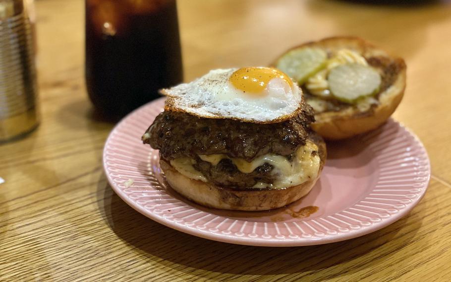 A teriyaki burger comes topped with a fried egg.