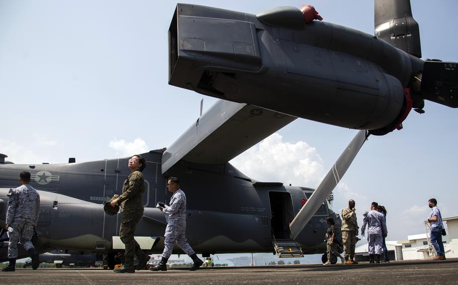 Philippine navy sailors tour of an Air Force CV-22 Osprey during a Balikatan drill at the former home of Naval Air Station Cubi Point, Sunday, April 23, 2023.