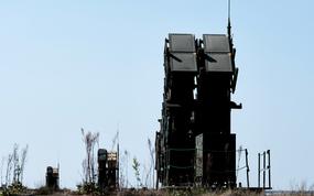 U.S. Army Patriot air defense systems sit in a field.