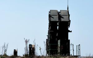 U.S. Army Patriot air defense systems sit in a field.