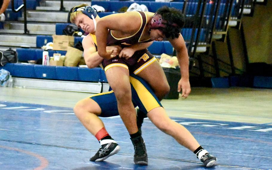 Guam High's Michael Bopp gains the upper hand on Father Duenas Memorial's Ryan Goffigan during Saturday's Guam wrestling dual meet. Bopp won by pin in 5 minutes, 22 seconds, but the Friars won the meet 43-21.