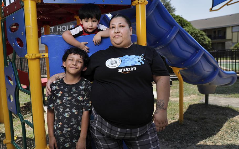 Victoria Halstead with two of her children, Jovani, 8, and Ismael, 3, on June 22 at the apartment complex playground where her 17-year-old son, Mark Halstead used to play as a child. Mark recently settled his manslaughter case in a plea bargain agreement after being in the Dallas County Juvenile Department inside the Henry Wade Juvenile Justice Center. He's been there since July 2022.
