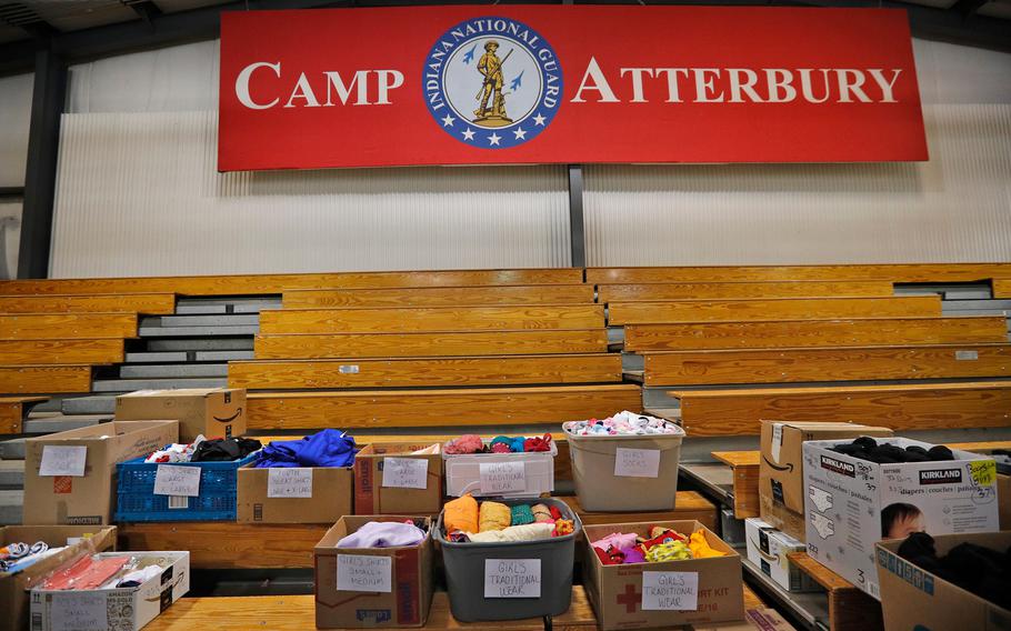 Donations are divided and categorized for different ages, male and female, for incoming evacuees Thursday, Oct. 14, 2021, at Camp Atterbury in Edinburgh, Ind.