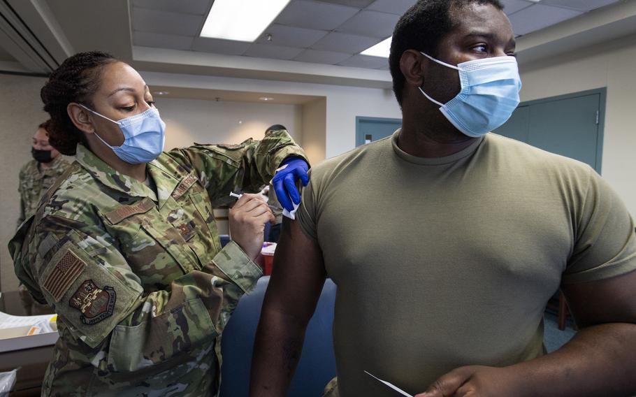 Capt. Shamira Conerly of the 149th Medical Group gives Staff Sgt. Timmy Sanders of the 149th Maintenance Squadron his first dose of the coronavirus vaccine at Joint Base San Antonio-Lackland, Texas, on March 18, 2021. 
