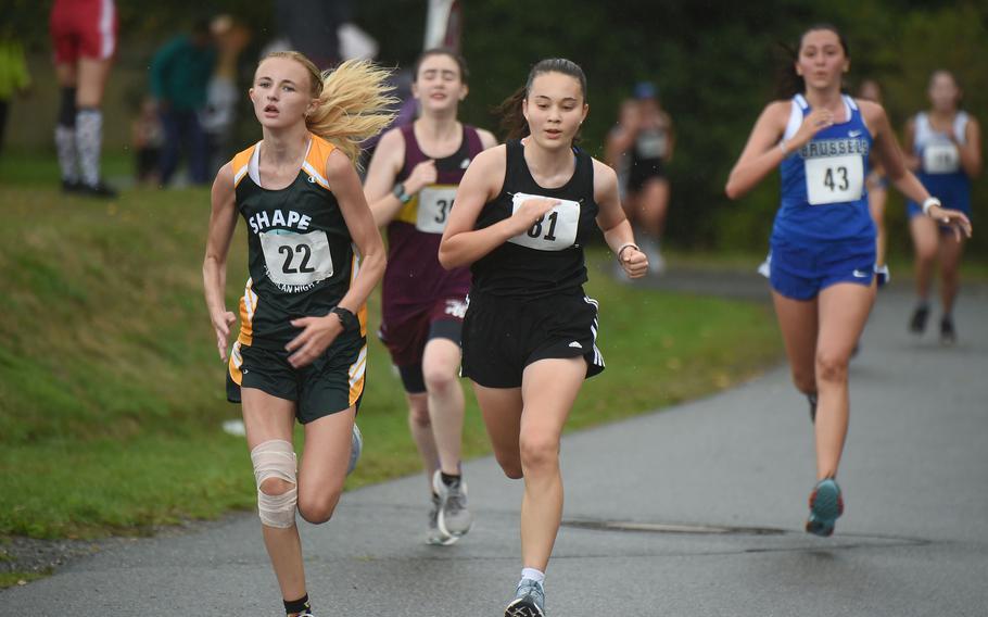 SHAPE runner Abby Hopkins, left, and Stuttgart runner Anna Roth battle for position on the last lap of the girls 3.1-mile cross country race at Vilseck, Germany, Saturday, Sept. 10, 2022.