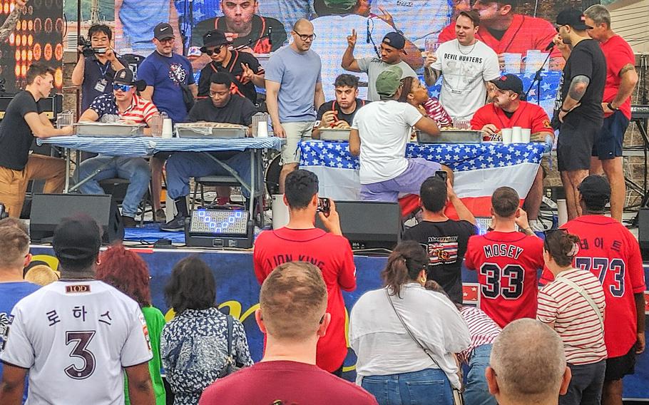 Contestants rallied for a hot dog eating contest at a July 4, 2024, celebration at Osan Air Base, South Korea.