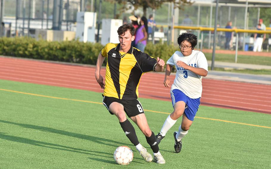 Vicenza's Caeleb Stelker, who had two assists in the Cougars' 5-3 victory over Rota, is chased by the Admirals' Jan Tyler Decastro on Friday, April 29, 2022.