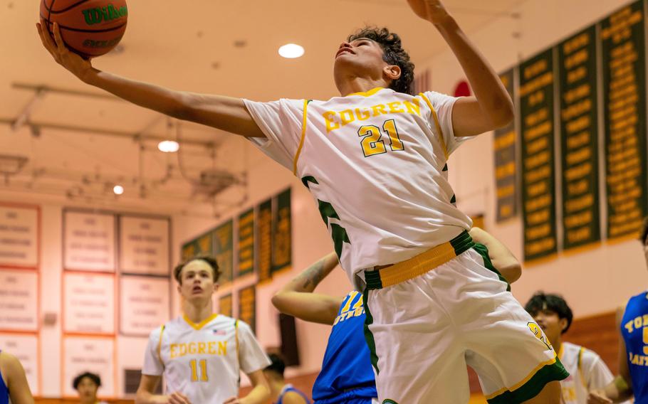 Robert D. Edgren's Noah Medonis leans in for a shot against Yokota during Friday's DODEA-Japan boys basketball game. The Panthers won 71-31.