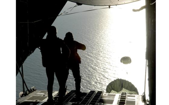 Hed: Over the North Sea, into the sun, 2007

Somewhere over the North Sea, Nov. 14, 2007: A group of 321st Special Tactics Squadron airmen jump out into a blinding ray of sunshine from a MC-130P Combat Shadow as part of a training exercise over the North Sea.

Check out the full story and see additional photos here.
https://www.stripes.com/news/2007-11-21/airmen-don-wetsuits-and-parachutes-for-north-sea-training-1980733.html1

META TAGS: MC-130P; 321st Special Tactics Squadron; training; 67th Special Operations Squadron; U.S. Air Force