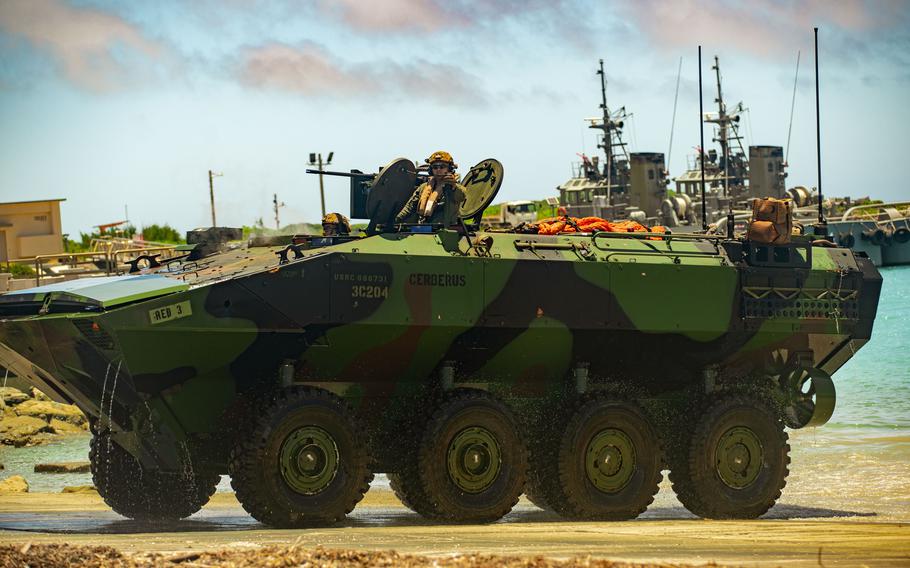 Marine Corps Amphibious Combat Vehicles of the 15th Marine Expeditionary Unit drive ashore after an amphibious landing at White Beach Naval Facility, Okinawa, Japan, June 24, 2024.