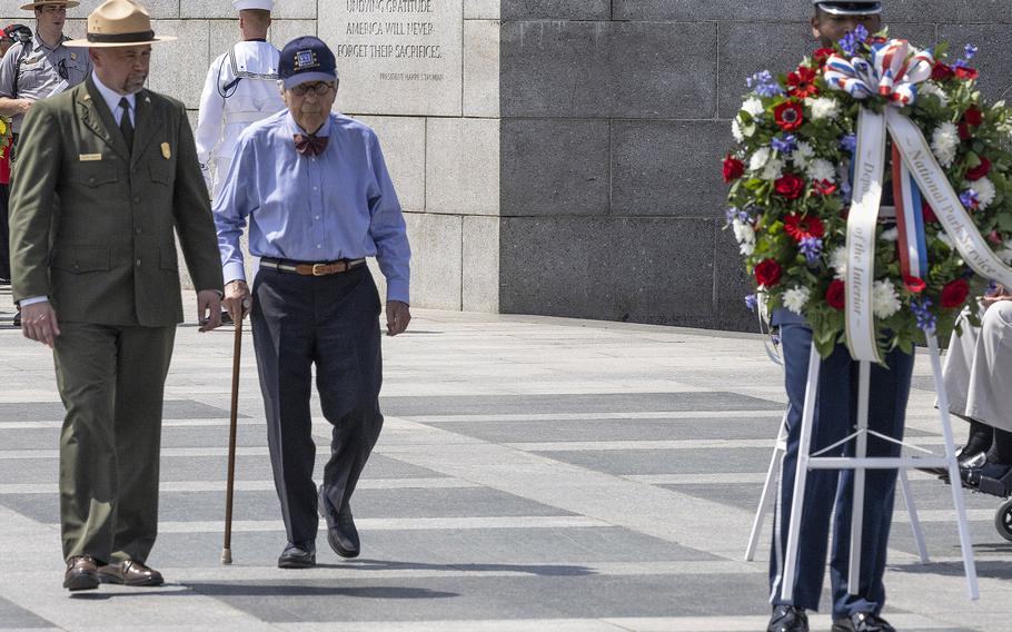 National Mall and Memorial Parks Superintendent Jeff Reinbold and memorial design architect Friedrich St. Florian place a wreath at the 20th anniversary celebration of the National World War II Memorial in Washington, May 25, 2024.