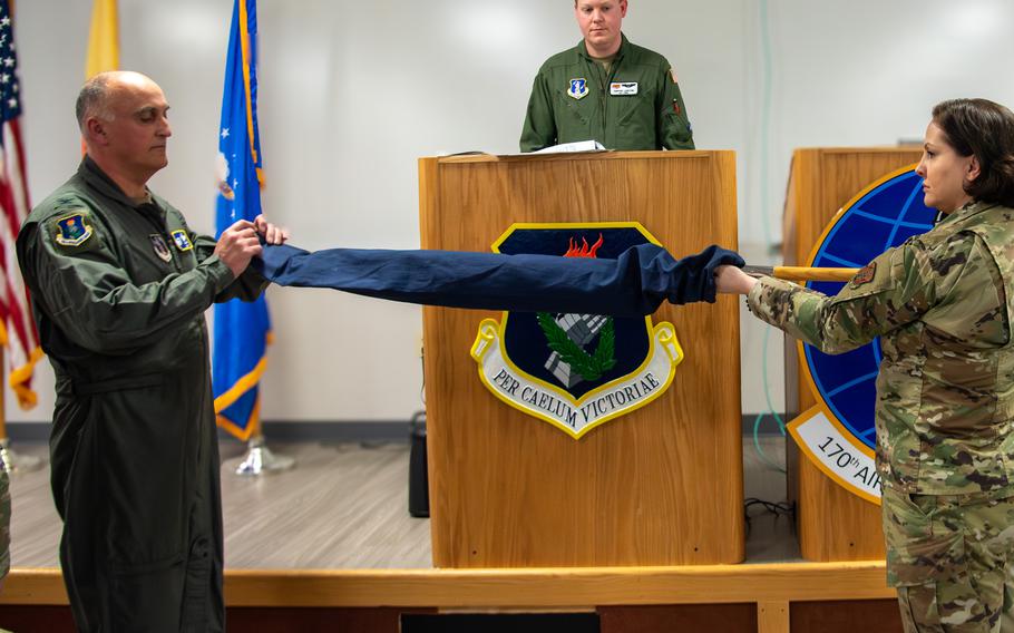 The guidon for the Air National Guard’s newest tanker squadron is revealed March 7, 2024, during the 170th assumption of command ceremony at Joint Base McGuire-Dix-Lakehurst, N.J.