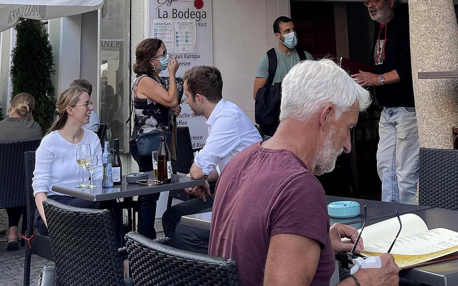 People eat at a restaurant in Weiden, Germany, where customers must follow the “3Gplus rule,” a reference to the first letter of the German words “geimpft, genesen, getested,” meaning “vaccinated, recovered or tested.” 