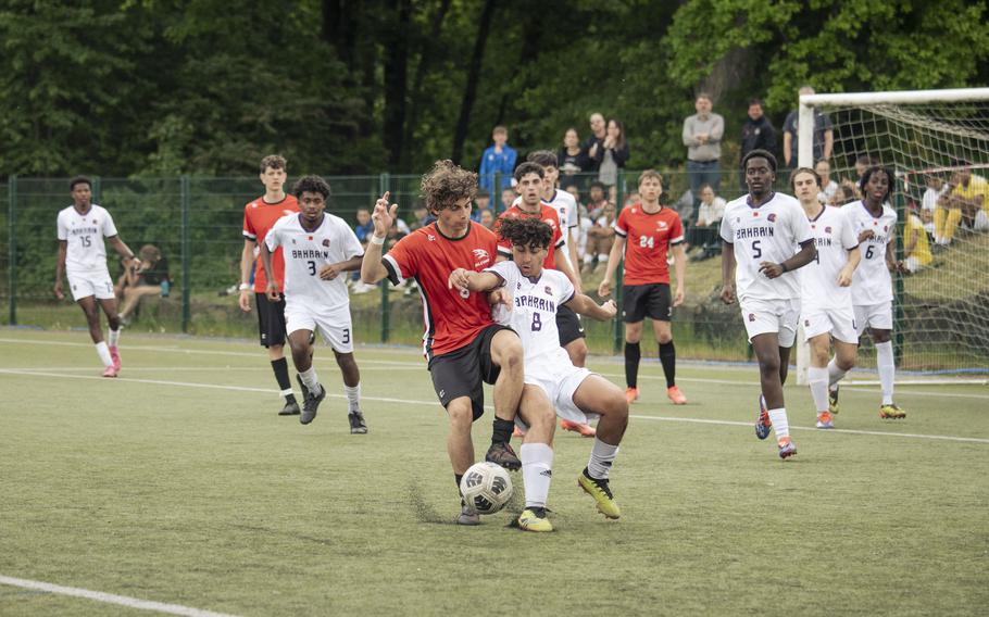Diego Mercado-Rodriguez, a sophomore with the Bahrain Falcons, defends against Leone Maggi, a sophomore with the American Overseas School of Rome Falcons during the semifinals of the 2025 Division II DODEA European championships at Reichenbach-Steegen, Germany on May 21, 2025.