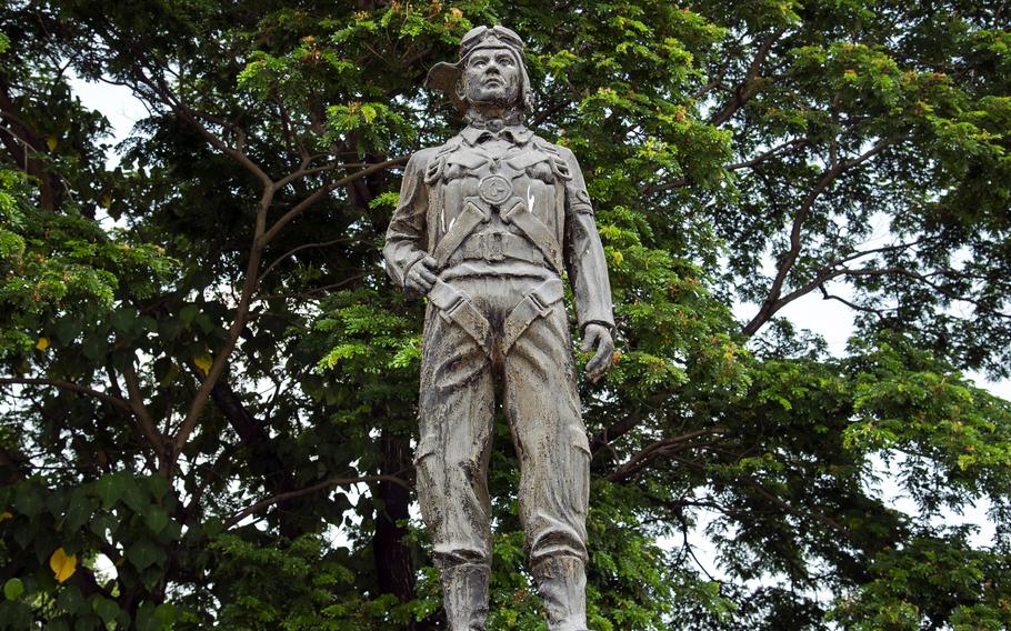 This roadside memorial near Clark Air Base in the Philippines reminds visitors that Japanese pilots on suicide missions took off nearby from “the very first Japanese Kamikaze Airfield.”