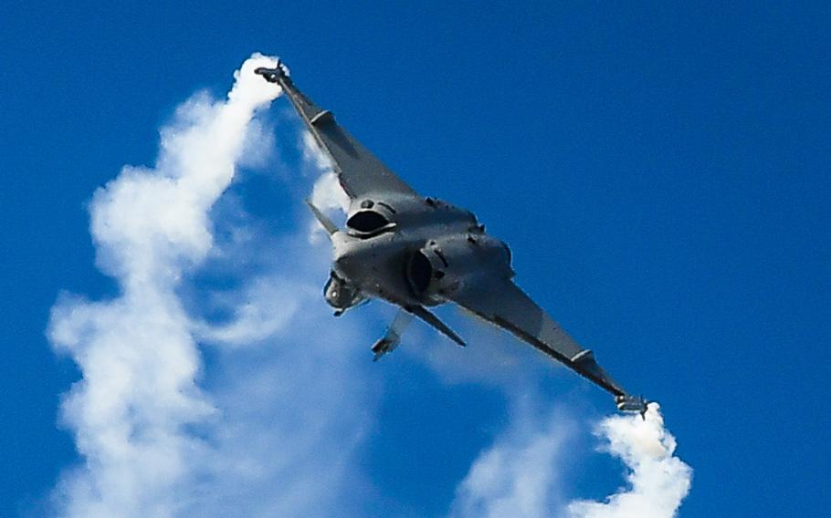 A French Dassault Rafale performs for a crowd of nearly 100,000 people at Le Bourget Airport, France, during the Paris Air Show, June 23, 2017. 