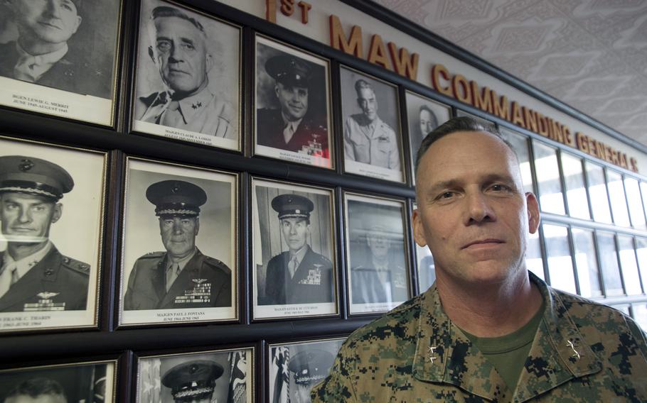 Maj. Gen. Eric Austin, commander of the 1st Marine Aircraft Wing, poses outside his office at Camp Foster, Okinawa, Oct. 21, 2022.
