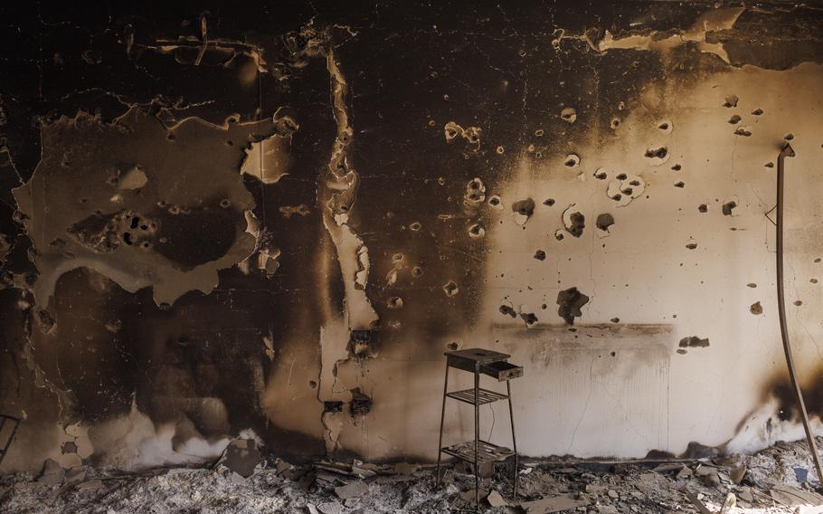 Bullet holes scar the walls of a burned house in Kibbutz Beeri, Israel, on Nov. 2, 2023.