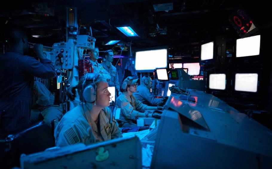 Sailors aboard the destroyer USS Carney stand watch during an operation to defeat a combination of Houthi missiles and aerial drones in the Red Sea on Oct. 19, 2023.
