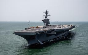 The aircraft carrier USS George Washington departs Newport News Shipbuilding in Virginia for sea trials on May 22, 2023.