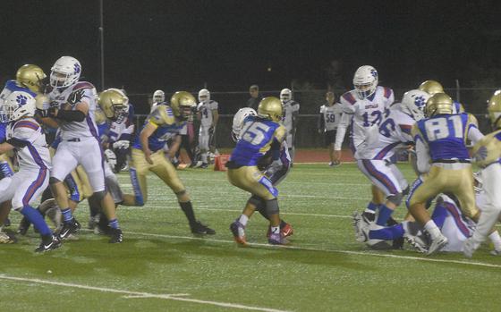 Wiesbaden running back Adam Gomes runs for a short gain agiants the Ramstein Royals on Friday, Sept. 17, 2021, in Wiesbaden. 