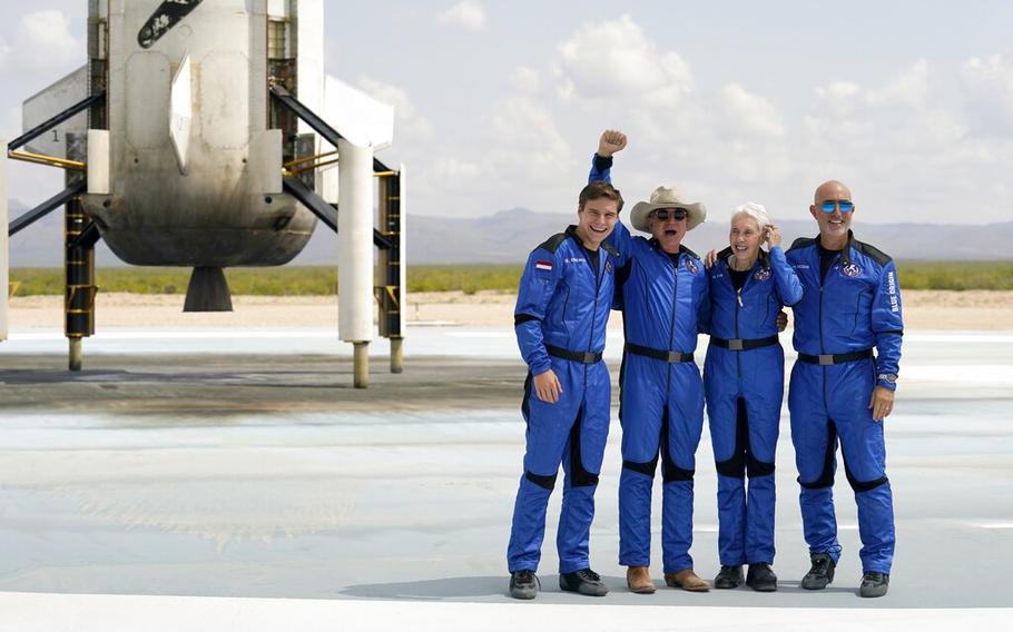 From left, Oliver Daemen, Jeff Bezos, founder of Amazon and space tourism company Blue Origin, Wally Funk and Bezos’ brother Mark pose in front of the Blue Origin New Shepard rocket, after their launch from the spaceport near Van Horn, Texas, on July 20, 2021. Blue Origin sent up its New Shepard rocket with humans on board on Saturday, June 4, 2022.