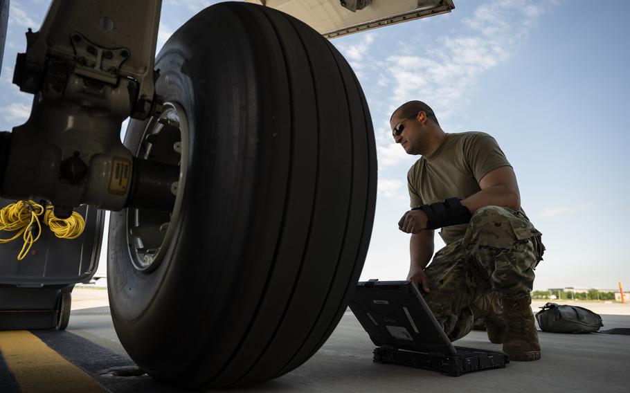 Tech. Sgt. Jorge Padron, 911th Aircraft Maintenance Squadron crew chief, conducts a tire inspection at the Pittsburgh International Airport Air Reserve Station, Pa., June 6, 2021. The Air Force is spending millions of dollars on a program to make rubber from a certain species of dandelion that grows in the United States and use it to produce items such as aircraft tires to cut dependency on foreign supplies, service officials said. 