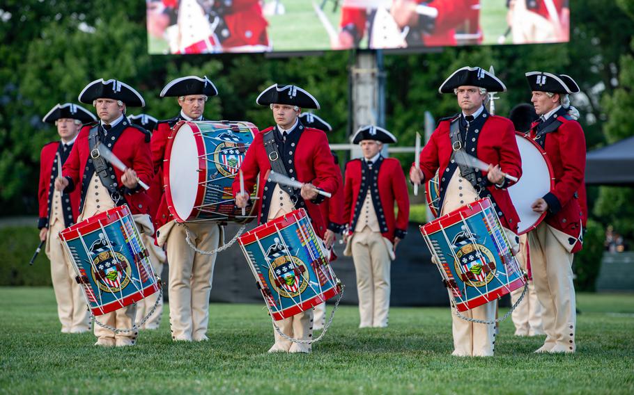 Soldiers assigned to the Fife and Drum Corps, 3rd U.S. Infantry Regiment (The Old Guard) perform in Twilight Tattoo in celebration of the 249th Birthday of the U.S. Army at Summerall Field, Joint Base Myer-Henderson Hall, Va., June 12, 2024. 