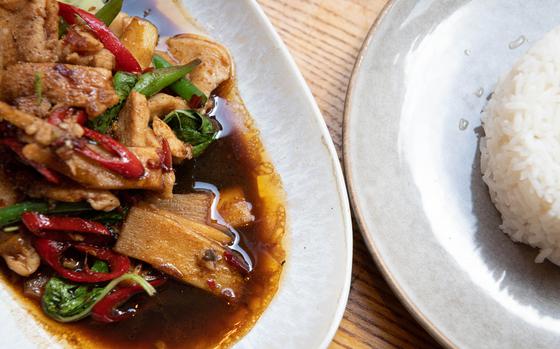 Pad krapao, made here with chicken, is a common Thai dish that typically consists of meat stir fried with Thai basil and garlic. It’s meant to balance sweet, salty, spicy and savory flavors. 