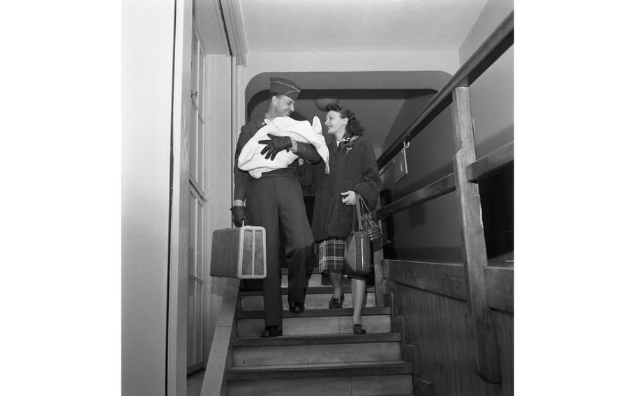 Brand-new parents leave the 97th General Hospital Maternity Ward with their newborn baby.