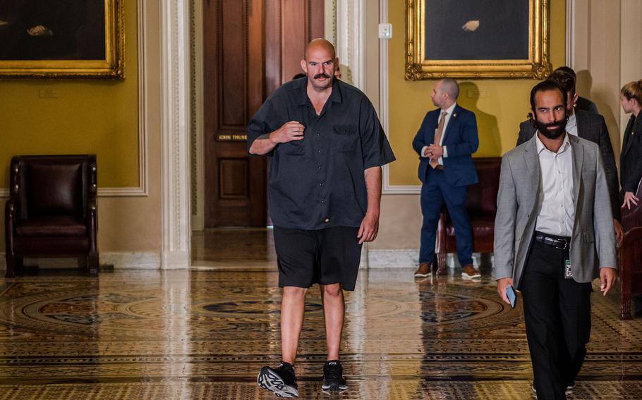 Sen. John Fetterman, D-Pa., walks toward the Senate Chamber on Sept. 21,2023.