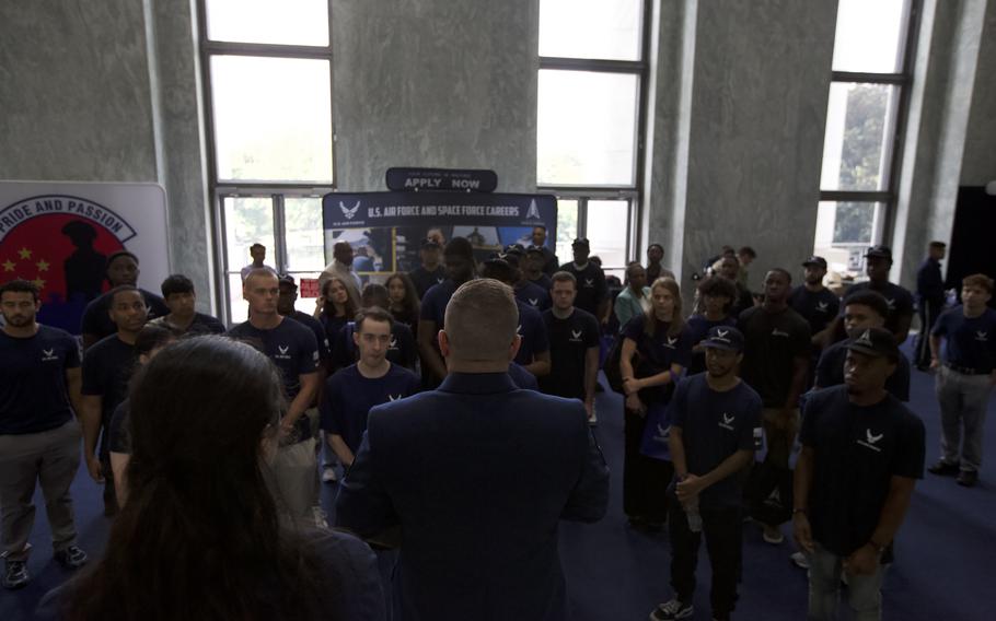Future airmen stand in front of their ranking officer.
