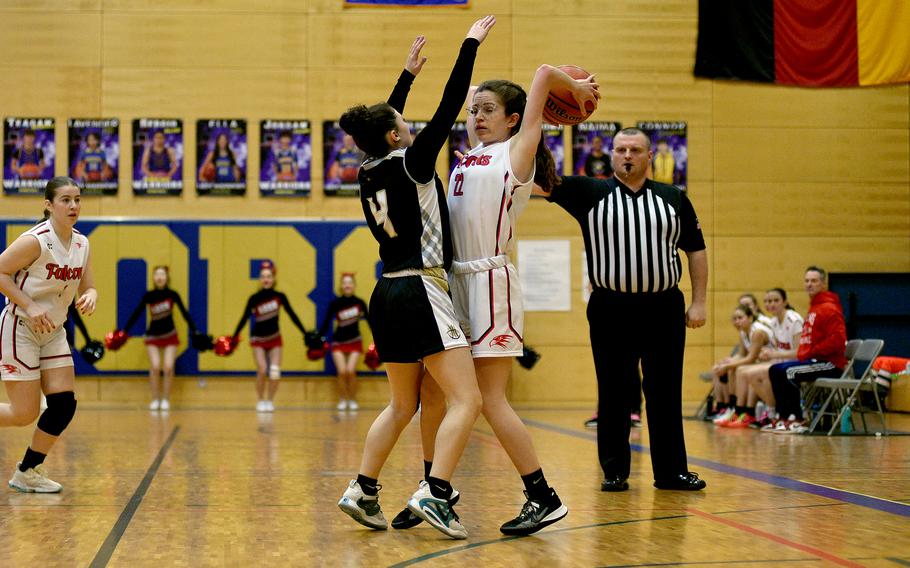 American Overseas School of Rome sophomore Claire Shekleton deals with pressure from Vicenza guard Kayla Steimle during a Division II semifinal at the DODEA European Basketball Championships on Feb. 16, 2024, at Wiesbaden High School in Wiesbaden, Germany.