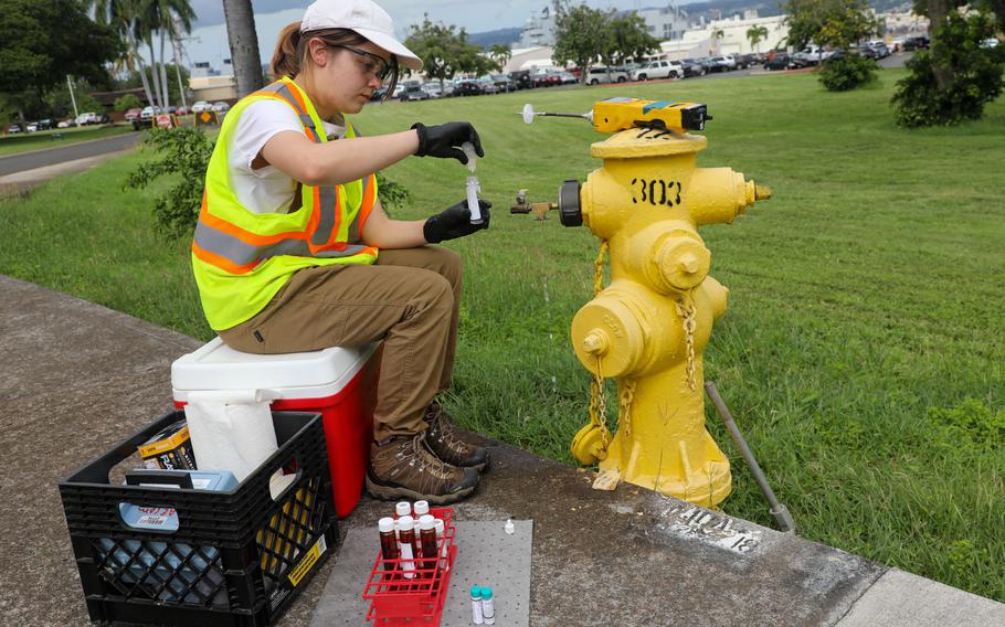 A Navy contractor collects water samples Jan. 31, 2024, as part of the Navy’s long-term monitoring program at Joint Base Pearl Harbor-Hickam, Hawaii.