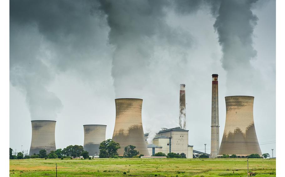 Cooling towers at the Eskom Holdings SOC Ltd. Arnot coal-fired power station in Mpumalanga, South Africa, on Tuesday, Dec. 26, 2023. Coal-fired power plants operated by South Africa’s state utility are emitting pollutants that primarily cause respiratory diseases such as asthma at almost 42 times the intensity of those in China. 