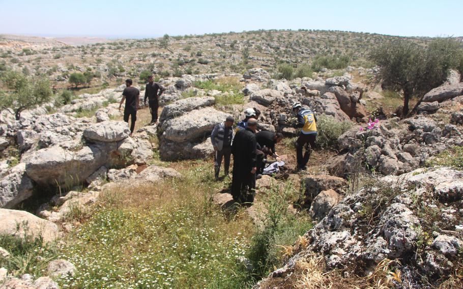 The Syria Civil Defense, also known as the White Helmets, recover the body of Lutfi Hasan Masto who was killed by a U.S. drone strike on May 3, 2023.