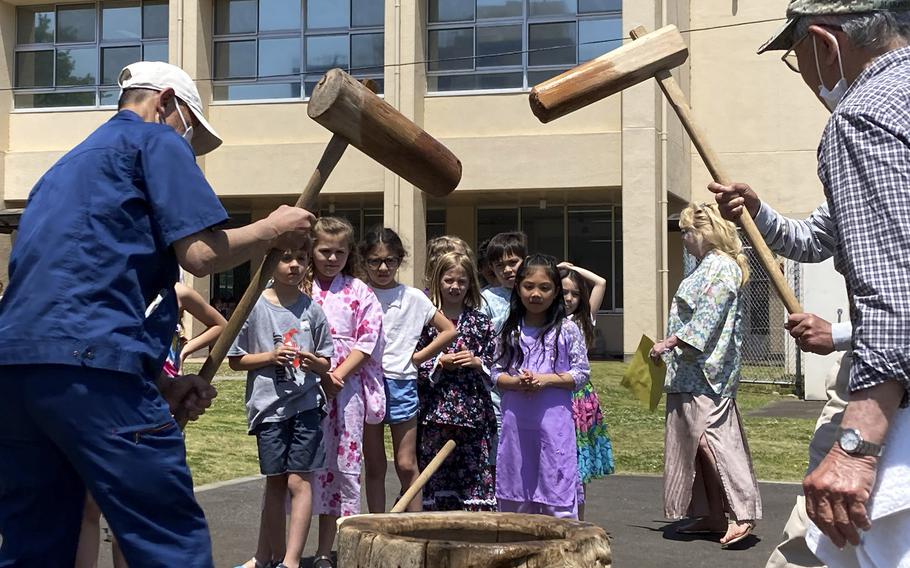 Japanese volunteers show students how to make mochi during the JaPANDAsia event at Joan K. Mendel Elementary School on Yokota Air Base, Japan, Thurdsay, May 4, 2023.