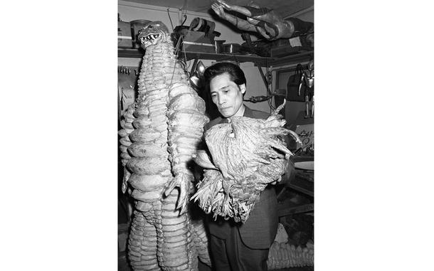 Toho Studio, Tokyo, Japan, June 10, 1966: Monster maker Ryosaku Takayama checks Ragon monster's head, with the monster Red King standing next to him, in the prop department on the set of the Japanese Ultraman television show. Takayama created many of the monster - also called kaiju - suits for Tsuburaya Productions. Before becoming part of the Ultraman team, Takayana also created Barugon -  an ancient reptilian kaiju with an extended tongue, rainbow death ray, and saliva that could freeze on impact -  who first appeared in Gamera vs. Barugon (1966).

Looking for Stars and Stripes’ historic coverage? Subscribe to Stars and Stripes’ historic newspaper archive! We have digitized our 1948-1999 European and Pacific editions, as well as several of our WWII editions and made them available online through https://starsandstripes.newspaperarchive.com/

META TAGS: Ultraman; ultra man; entertainment; TV show; television; Japan; Japanese entertainment; superhero; Tokusatsu; Kaiju; aliens; science fiction; monsters; costumes; costume design; culture; film set; celebrity
