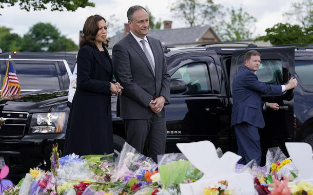 Vice President Kamala Harris and her husband Doug Emhoff visit a memorial near the site of the Buffalo supermarket shooting after attending a memorial service for one of the victims, Ruth Whitfield, Saturday, May 28, 2022, in Buffalo, N.Y. (AP Photo/Patrick Semansky)